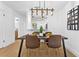 Elegant dining area with modern lighting and ample space for entertaining guests at 311 Sandlewood Trl # 4, Winter Park, FL 32789