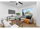 Contemporary living room featuring stylish furniture, a ceiling fan, and plenty of natural light at 311 Sandlewood Trl # 4, Winter Park, FL 32789