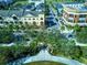 Aerial view of the community showcasing a central park, commercial buildings, and convenient accessibility at 3668 Peppervine Dr, Orlando, FL 32828