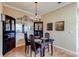 Elegant dining room with decorative mirror, wood floors, and classic furnishings at 3668 Peppervine Dr, Orlando, FL 32828