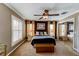 Inviting main bedroom with a ceiling fan, modern lighting, and natural light from the window at 3668 Peppervine Dr, Orlando, FL 32828