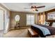 Relaxing main bedroom featuring a ceiling fan and natural light shining through the window at 3668 Peppervine Dr, Orlando, FL 32828