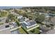 Overhead image of a community featuring a home with solar panels, a screened pool, and mature trees at 38 Lakeview Reserve Blvd, Winter Garden, FL 34787