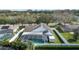 Elevated view of the property showing a screened pool, solar panels, and well-maintained landscaping at 38 Lakeview Reserve Blvd, Winter Garden, FL 34787