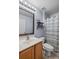 Bathroom featuring a wood vanity, mirror, shelving, and tiled floor at 38 Lakeview Reserve Blvd, Winter Garden, FL 34787