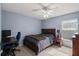 Bedroom featuring a ceiling fan, a desk with chair, and natural light at 38 Lakeview Reserve Blvd, Winter Garden, FL 34787