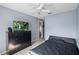 Bedroom featuring gray walls, ceiling fan, black furnishings, and carpet flooring at 38 Lakeview Reserve Blvd, Winter Garden, FL 34787