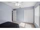 Well-lit bedroom offering a ceiling fan, carpeted floor, large closet space, and neutral tones at 38 Lakeview Reserve Blvd, Winter Garden, FL 34787