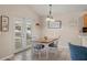 Cozy dining area featuring a chandelier, tile flooring, and sliding doors to the patio at 38 Lakeview Reserve Blvd, Winter Garden, FL 34787