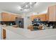 Kitchen area with stainless steel appliances, breakfast bar, and tiled backsplash at 38 Lakeview Reserve Blvd, Winter Garden, FL 34787