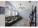 Comfortable living room featuring plush seating, a ceiling fan, and plenty of natural light at 38 Lakeview Reserve Blvd, Winter Garden, FL 34787