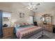 This main bedroom features a ceiling fan, ensuite bathroom, and calming neutral tones at 38 Lakeview Reserve Blvd, Winter Garden, FL 34787