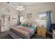 Cozy main bedroom showcases a ceiling fan, bedside tables, and windows for natural light at 38 Lakeview Reserve Blvd, Winter Garden, FL 34787