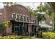 Brick building with large windows, dark awnings, and outdoor seating at 38 Lakeview Reserve Blvd, Winter Garden, FL 34787