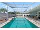 Sparkling pool and spa with waterfall feature, enclosed in a screened lanai for year-round enjoyment at 38 Lakeview Reserve Blvd, Winter Garden, FL 34787