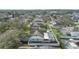 Aerial view of a property featuring a screened pool, fenced yard, and mature landscaping at 38 Lakeview Reserve Blvd, Winter Garden, FL 34787