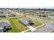 Overhead view of a residential neighborhood with houses, streets, and a community pool at 3842 Rory Oak Circle, Apopka, FL 32703