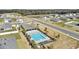 Aerial of the community pool surrounded by lounge chairs and palm trees at 3842 Rory Oak Circle, Apopka, FL 32703