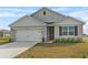 Attractive single-story home featuring a clean design and a spacious driveway at 3842 Rory Oak Circle, Apopka, FL 32703