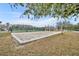 Sand volleyball court for residents to enjoy, surrounded by trees at 4004 San Gallo Dr # 107, Kissimmee, FL 34741