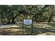 Live Oak Park sign surrounded by mature shade trees and lawn area with paved walking path at 4464 Cleary Way, Orlando, FL 32828