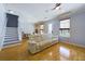 Open-concept living room showcasing hardwood floors, staircase, and neutral color palette at 4464 Cleary Way, Orlando, FL 32828