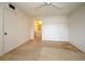 Bedroom featuring neutral carpet, ceiling fan and a view to a bathroom at 536 Orange Dr # 16, Altamonte Springs, FL 32701