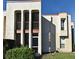 Exterior shot of a condominium building featuring balconies and large windows at 536 Orange Dr # 16, Altamonte Springs, FL 32701