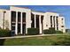 Exterior shot of a condominium building with large windows and well-maintained landscaping at 536 Orange Dr # 16, Altamonte Springs, FL 32701