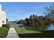 Lake view with sidewalk access and surrounding trees and landscaping at 536 Orange Dr # 16, Altamonte Springs, FL 32701