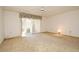 Light-filled living room with sliding glass doors, neutral carpet, and a ceiling fan at 536 Orange Dr # 16, Altamonte Springs, FL 32701