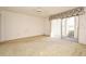 Large living room featuring carpet flooring, a ceiling fan, and a sliding glass door to the outside at 536 Orange Dr # 16, Altamonte Springs, FL 32701