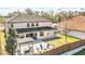 Spacious backyard features a pergola, fire pit, lush lawn, and a private fence at 5774 Fulham Pl, Sanford, FL 32771