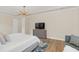 Spacious bedroom features light wood flooring and a modern ceiling light fixture at 5774 Fulham Pl, Sanford, FL 32771