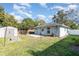 Backyard with a shed, fenced yard, and well-maintained lawn at 610 Carolina Ave, St Cloud, FL 34769