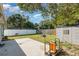 Backyard featuring a shed, concrete patio, and fenced yard at 610 Carolina Ave, St Cloud, FL 34769