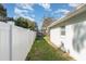 Backyard features a well-maintained lawn and white vinyl fence at 610 Carolina Ave, St Cloud, FL 34769