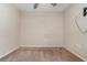 Empty bedroom with neutral carpet, ceiling fan, and window at 610 Carolina Ave, St Cloud, FL 34769