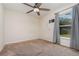 Neutral bedroom with a ceiling fan and window views at 610 Carolina Ave, St Cloud, FL 34769