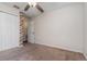 Neutral bedroom featuring plush carpet flooring, closet and white walls at 610 Carolina Ave, St Cloud, FL 34769