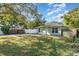 Charming single-story home with a manicured lawn and inviting front entrance at 610 Carolina Ave, St Cloud, FL 34769