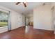 Inviting living room features wood flooring, bright windows, and neutral paint at 610 Carolina Ave, St Cloud, FL 34769