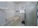 Bathroom featuring a soaking tub and glass enclosed shower at 7532 Bay Port Rd # 18, Orlando, FL 32819