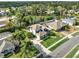 Aerial view of home showcasing roof, screened-in pool, yard, and surrounding neighborhood at 795 Sterling Chase Dr, Port Orange, FL 32128