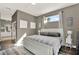 Neutral main bedroom with a plush rug, ensuite bath and bright window at 795 Sterling Chase Dr, Port Orange, FL 32128