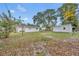 The backyard offers plenty of space, a storage shed, and lush landscaping at 807 Vercelli St, Deltona, FL 32725