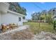 The backyard features a patio area with seating and a large fenced-in yard at 807 Vercelli St, Deltona, FL 32725