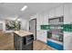 Modern kitchen featuring white cabinets, stainless steel appliances, and a butcher block island at 807 Vercelli St, Deltona, FL 32725