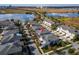 Aerial shot of a quiet residential neighborhood with sidewalks, landscaping, and nearby lakes at 8163 Upper Perse Cir, Orlando, FL 32827