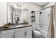 Well-lit bathroom featuring a granite countertop, white cabinets, and a shower-tub combo with modern fixtures at 8163 Upper Perse Cir, Orlando, FL 32827